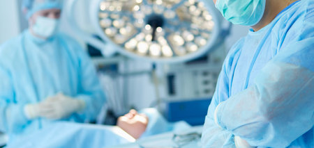 Male surgeon on background in operation room