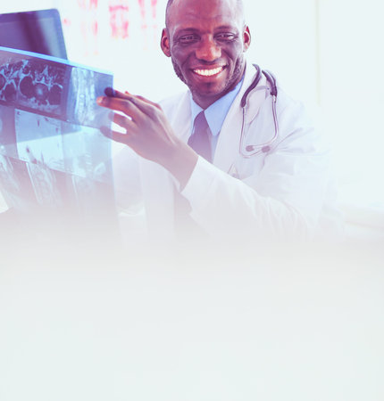 Portrait young african medical doctor holding patients x-ray