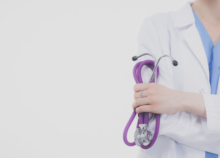 Portrait of female doctor standing against isolated on white background. Woman doctor.の写真素材
