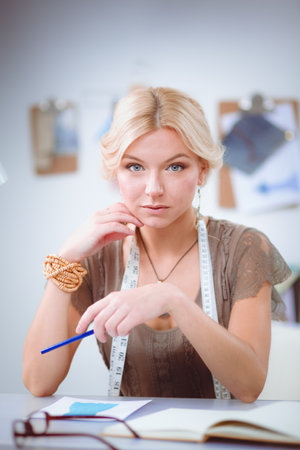 Young fashion designer working at studio.の写真素材