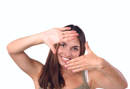 Young attractive woman framing her handsの写真素材