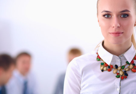 Portrait of a young woman working at office standingの写真素材