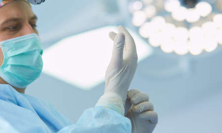 Man surgeon at work in operating roomの写真素材