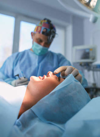 Man surgeon at work in operating roomの写真素材