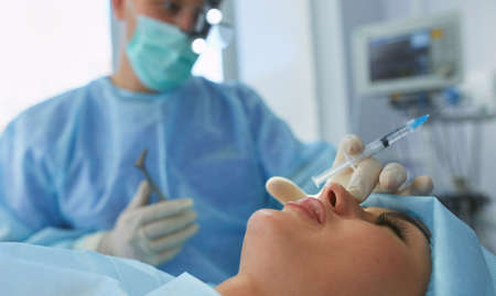 Man surgeon at work in operating roomの写真素材