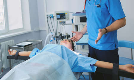 Male surgeon on background in operation roomの写真素材