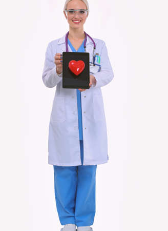 Young woman doctor holding a red heart, isolated on white background. Woman doctorの写真素材
