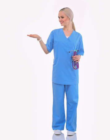 A portrait of a female doctor pointing, close-up, isolated on white background. Woman doctorの写真素材
