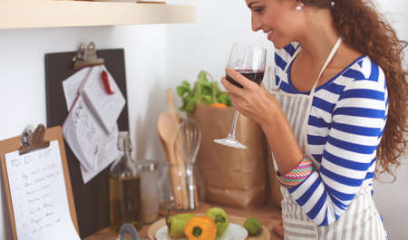 Attractive woman preparing food in the kitchenの写真素材