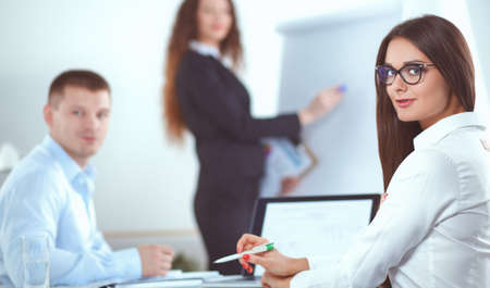 Business people sitting and discussing at business meeting, in officeの写真素材
