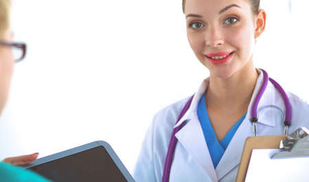 Woman doctor standing at hospitalの写真素材