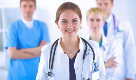 Attractive female doctor in front of medical groupの写真素材