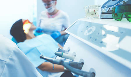 Close up view at set of dentist tools in modern dental officeの写真素材