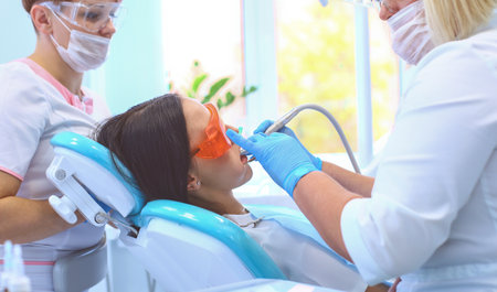 Healthy teeth patient at dentist office dental caries preventionの写真素材