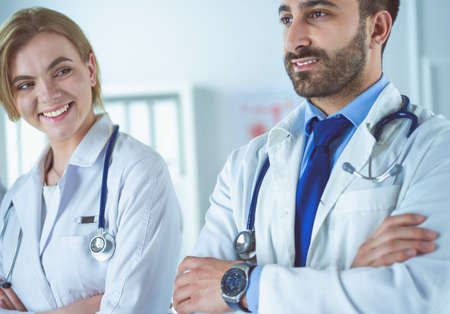 Portrait of confident doctors with arms crossed at medical officeの写真素材