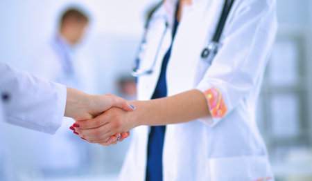 Young medical people handshaking at officeの写真素材