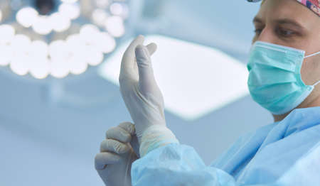Man surgeon at work in operating roomの写真素材