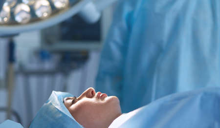Man surgeon at work in operating roomの写真素材