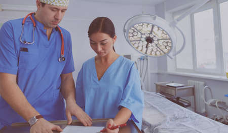 Man surgeon at work in operating roomの写真素材