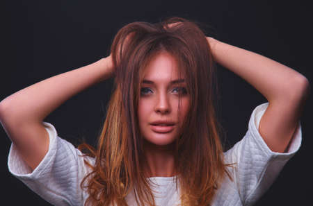 Portrait of a beautiful woman , isolated on black backgroundの写真素材
