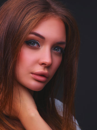 Portrait of a beautiful woman , isolated on black backgroundの写真素材