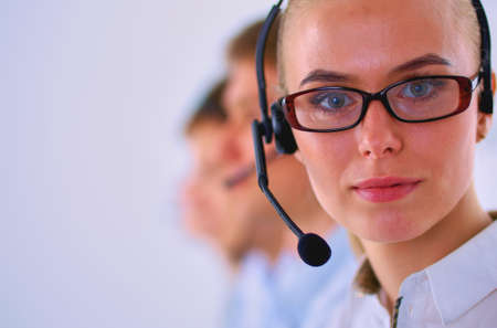 Attractive positive young businesspeople and colleagues in a call center officeの写真素材