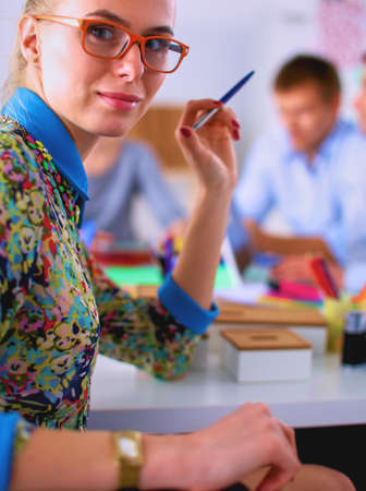 Portrait of attractive female designer in officeの写真素材