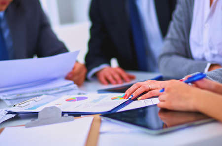 Business people sitting and discussing at business meeting, in officeの写真素材