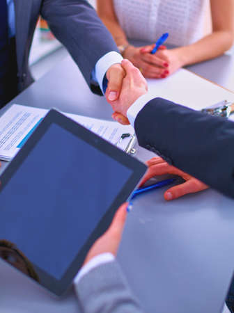 Business people shaking hands, finishing up a meetingの写真素材