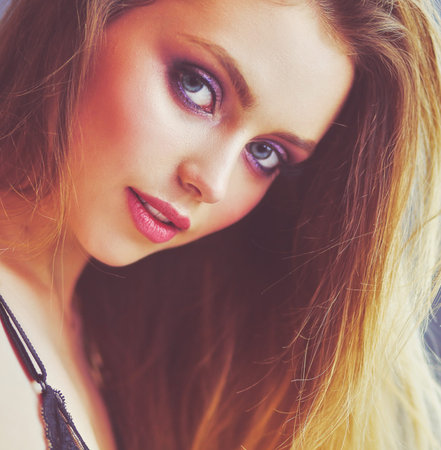 Young beautiful woman lying in bed.