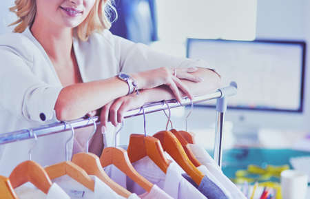 Fashion designer woman working on her designs in the studio.の写真素材