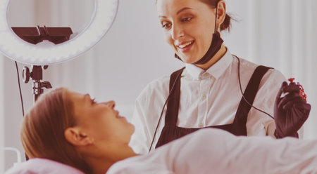 Microblading eyebrows work flow in a beauty salon.の写真素材