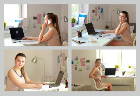 Beautiful business woman working at her desk with headset and laptopの写真素材