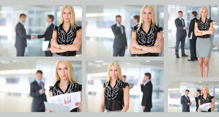 Business woman standing in foreground in officeの写真素材