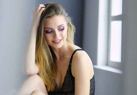 Sexy fashionable woman on the bedの写真素材
