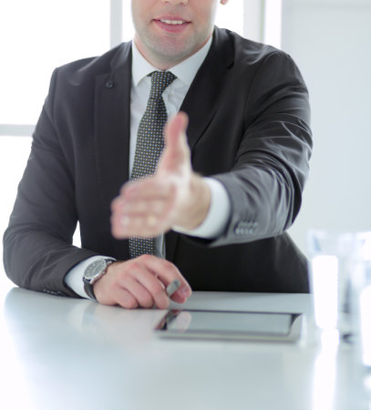 Portrait of businessman giving hand for handshake.の写真素材