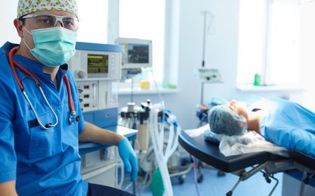 Male surgeon on background in operation roomの写真素材