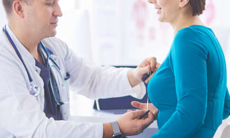 The patient and his doctor in medical officeの写真素材