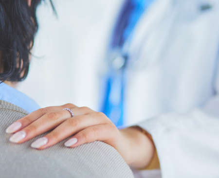 Female doctor giving a consultation to a patient and explaining medical informations and diagnosisの写真素材