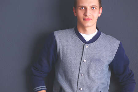 Portrait of a handsome young man on black backgroundの写真素材