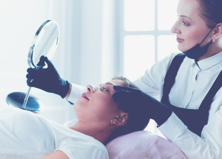 Microblading eyebrows work flow in a beauty salon.の写真素材