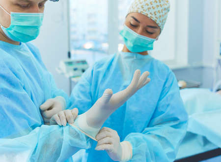 Male surgeon on background in operation roomの写真素材