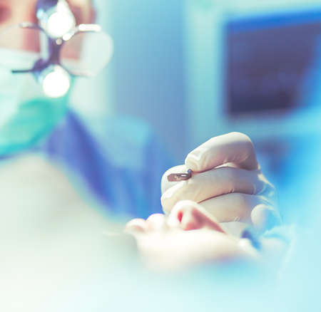 Man surgeon at work in operating roomの写真素材