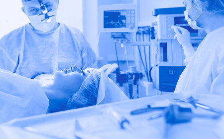 Man surgeon at work in operating roomの写真素材