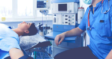 Male surgeon on background in operation roomの写真素材
