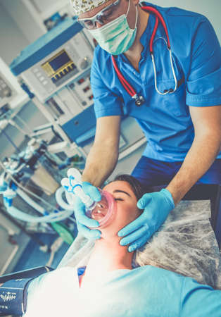 Man surgeon at work in operating roomの写真素材