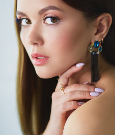 Beautiful young woman with professional make upの写真素材