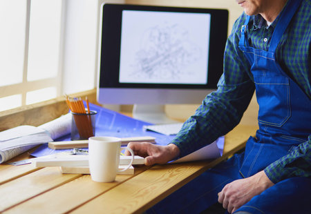 Architect working on drawing table in office