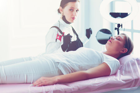 Microblading eyebrows work flow in a beauty salon.の写真素材