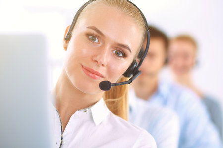 Attractive positive young businesspeople and colleagues in a call center officeの写真素材